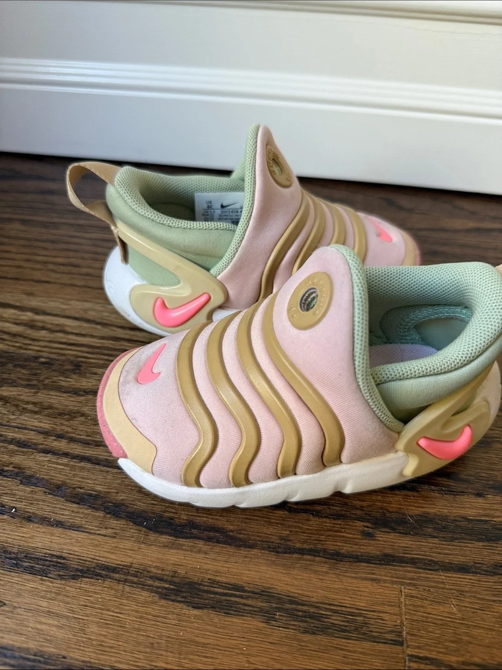 Pink and green Nike dynamo go